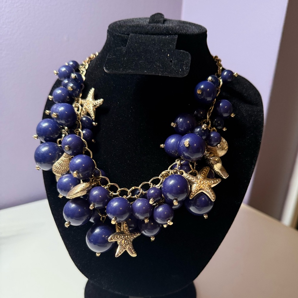 Gold Sea Charm Statement Necklace with Navy Blue Beaded Clusters